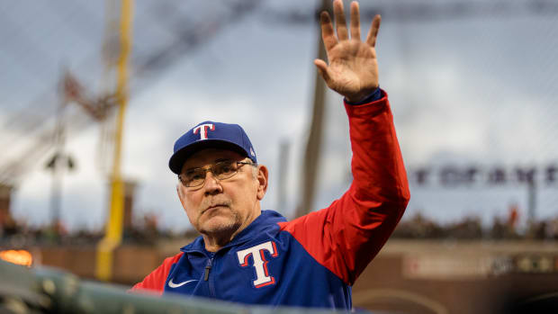 Texas Rangers manager and former SF Giants manager Bruce Bochy waves to the crowd during the third inning at Oracle Park on August 11, 2023.